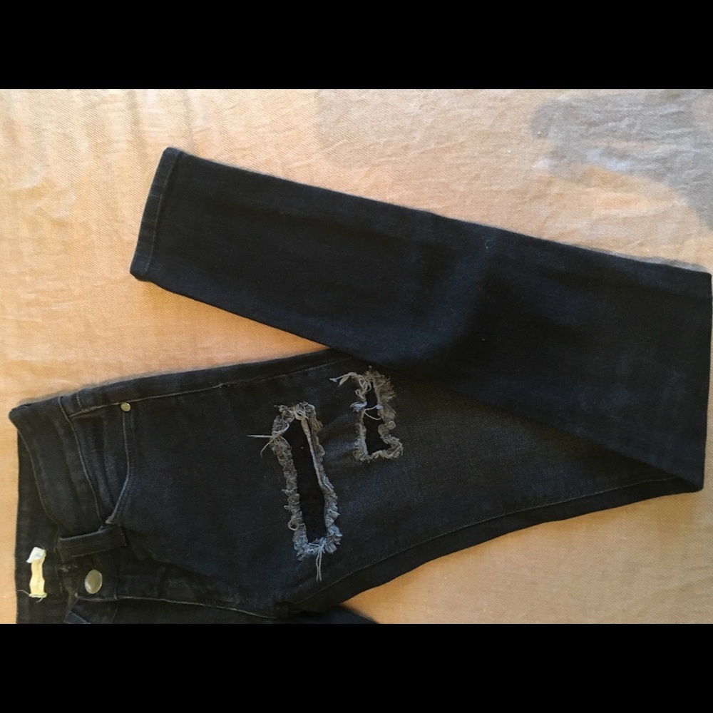 Black lace skinny jeans from Urban Outfitters.